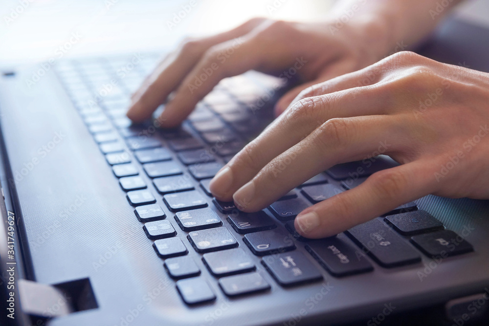 Close-up female hands on laptop notebook computer keyboard, working online Close-up female hands on laptop notebook computer keyboard, working online