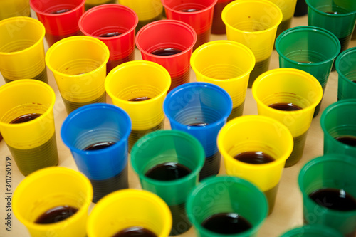 colorful plastic cups filled with juice