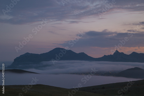  Gloomy mountain landscape with fog © Roman
