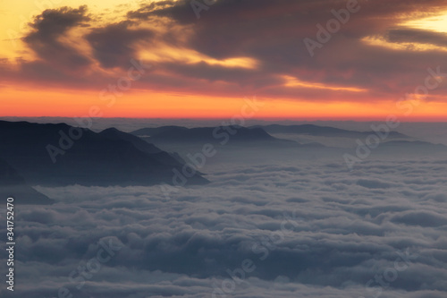  Landscape with fog at dawn and mountains that rise from the fog