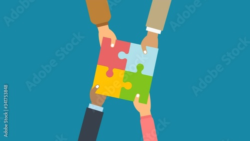 Teamwork concept. Businessman hold in hands and connect the pieces of jigsaw puzzle. Team work business metaphor. 4K video animation with alpha channel.