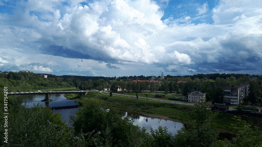 clouds gathered over the small town and river