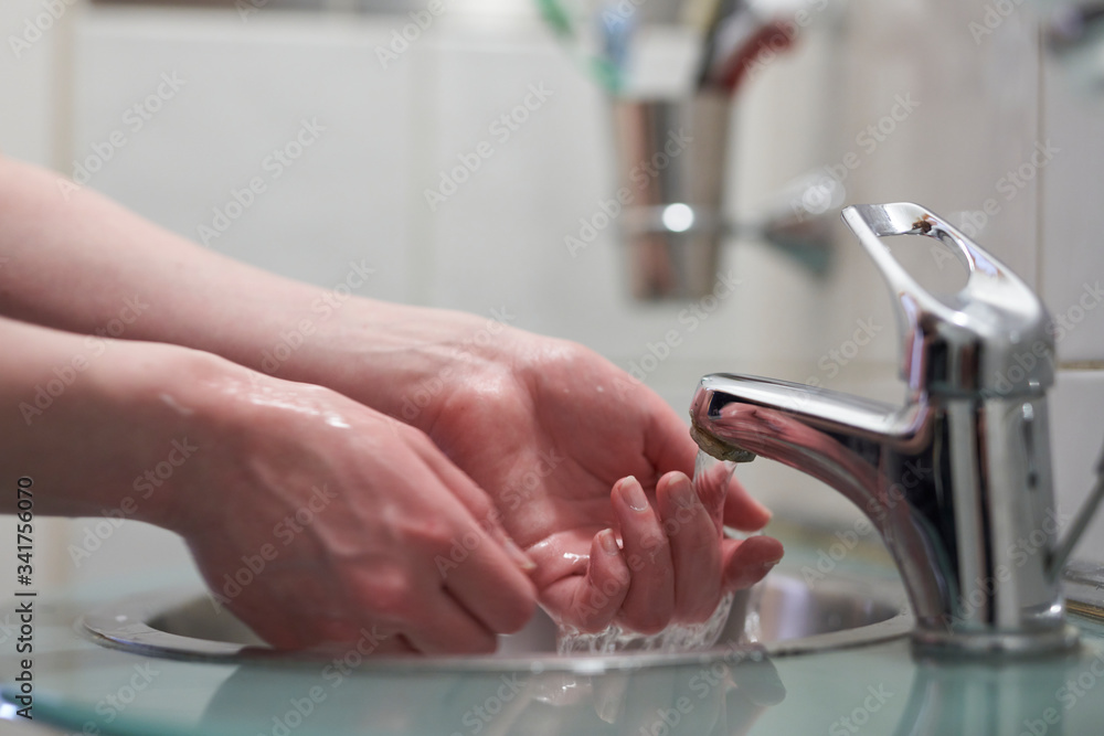 close up of Female hands washing close up of Female hands washing