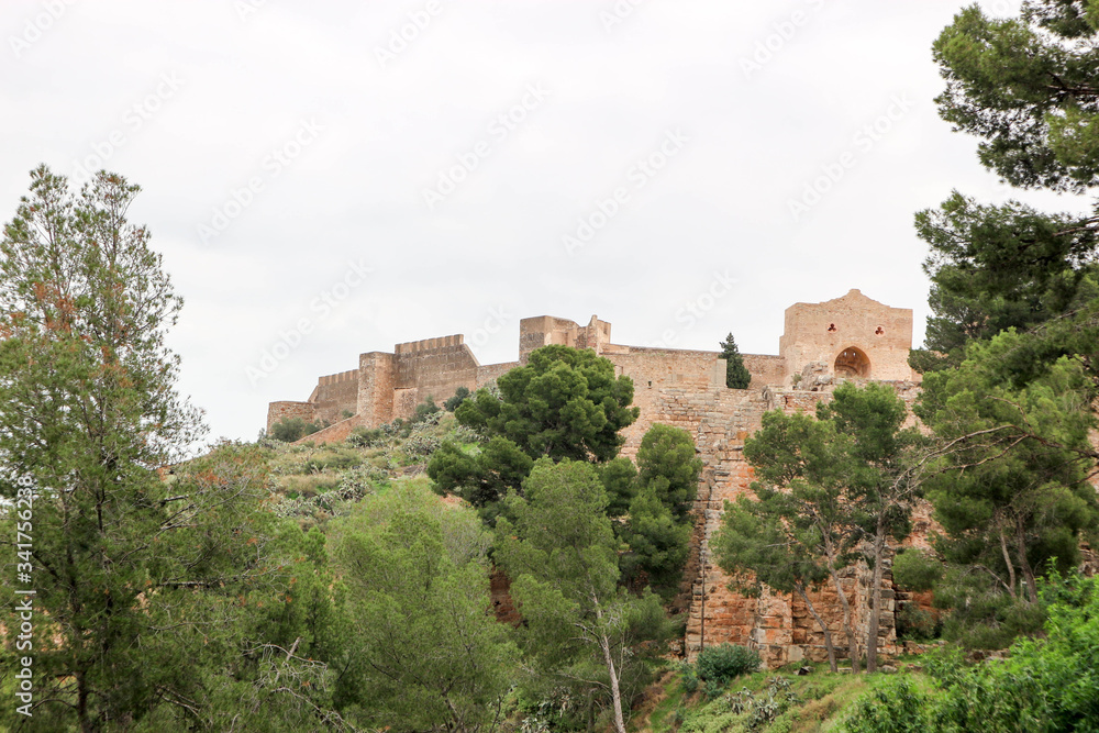 View from below to beautiful ruins of the medieval Sagunto castle in Spain