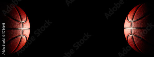 Basketball on a black background. panoramic background or basketball with blank space photo