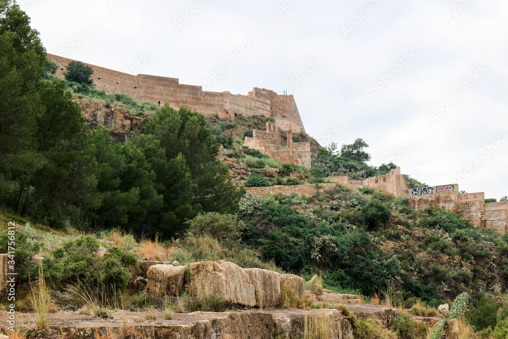 Scenic view of medieval Sagunto castle on the green hill in Spain
