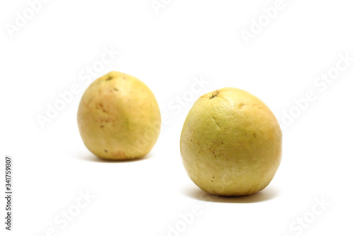 Two red guavas  Psidium guajava  isolated on white background  perfect for breakfasting during ramadan