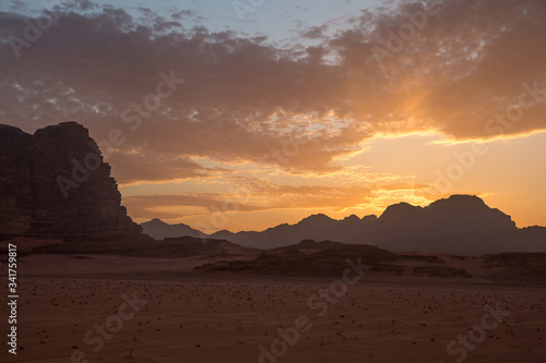 Beautiful sunset in the desert. View from the cliff. Taken in Jordan in March 2020