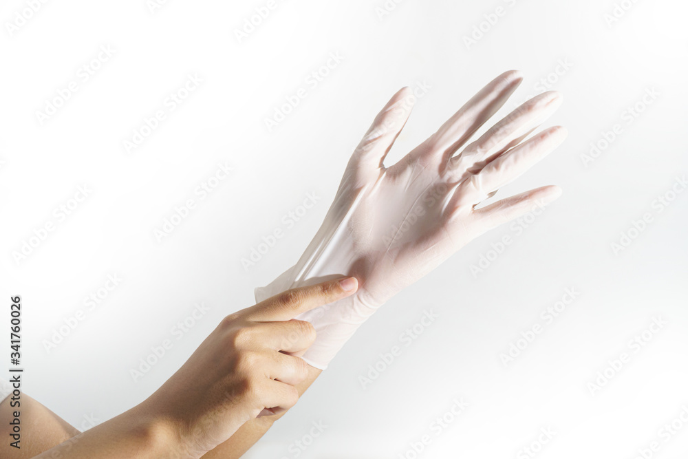 Woman hands wering rubber glove protection safety covid 19 white background