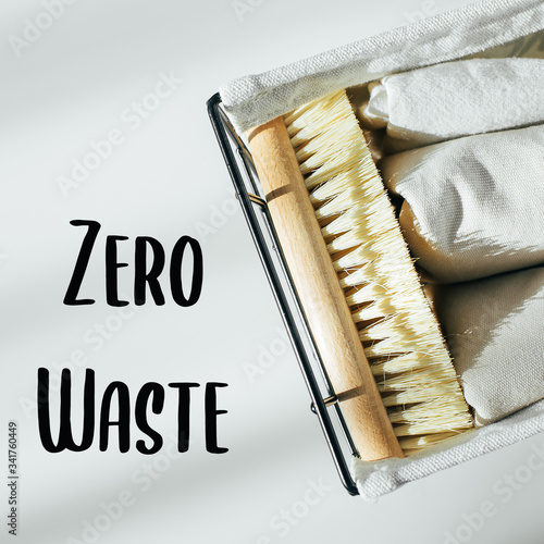 Eco natural body brush and cotton towel in metal basket. Zero waste concept. Plastic free.