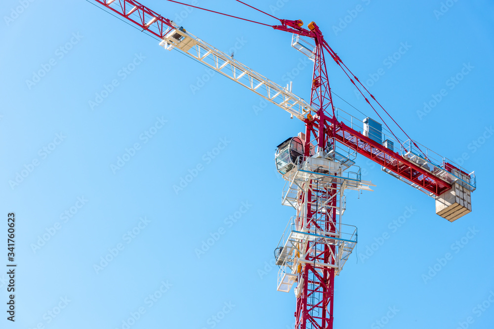 Tower crane on a construction site in the mountains mountains Tower crane on a construction site in the mountains mountains
