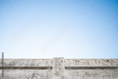 Dirty cement terrace with blue sky.