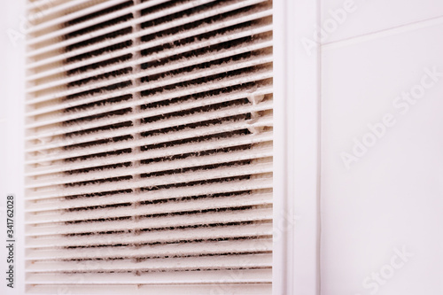 A layer of dust on the ventilation grill in the bathroom. To clean ventilation at home.