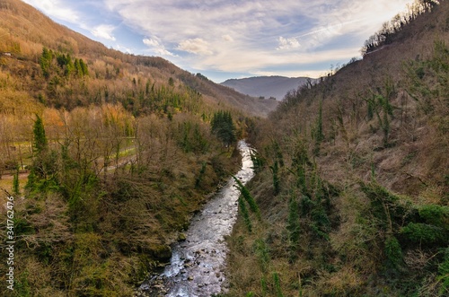 Mountain landscape with river running through it