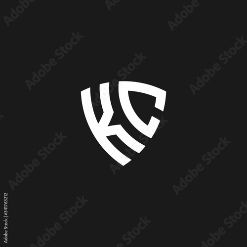 KC monogram logo with shield shape