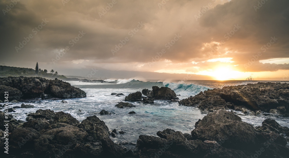 Beautiful waves and sunset in tropical ocean. Hawaiian reef and cove on Oahu. 