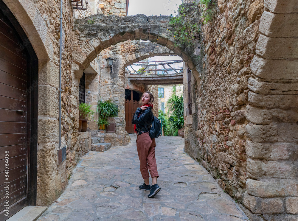 Walking and smelling flowers in the beautiful medieval village of Pals on the Catalan coast. Walking and smelling flowers in the beautiful medieval village of Pals on the Catalan coast.