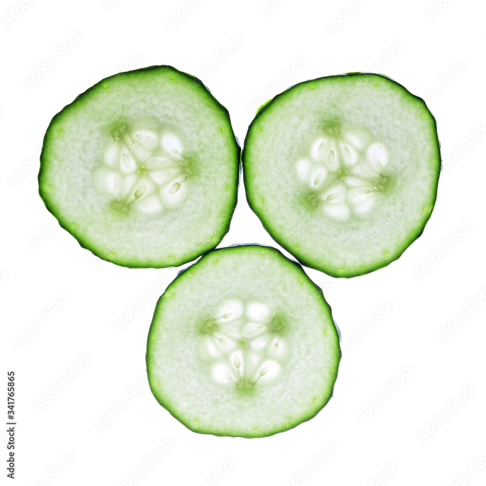 Sliced cucumber isolated on a white background. Healthy eating. Top view. Vegetarian food. Sliced cucumber isolated on a white background. Healthy eating. Top view. Vegetarian food.