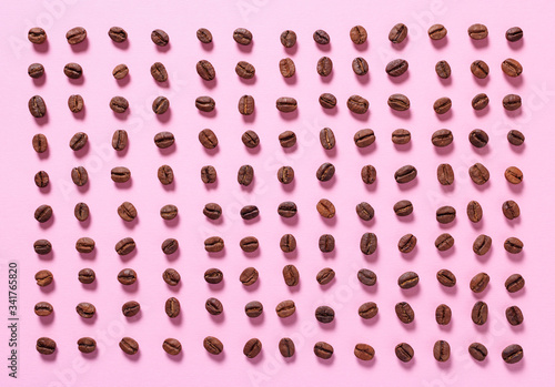 Coffee beans on a pink background. Food Background.