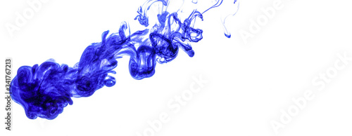 Blue ink injected into water from syringe, colour mixing with water creating abstract shapes, white background banner with space for text right side
