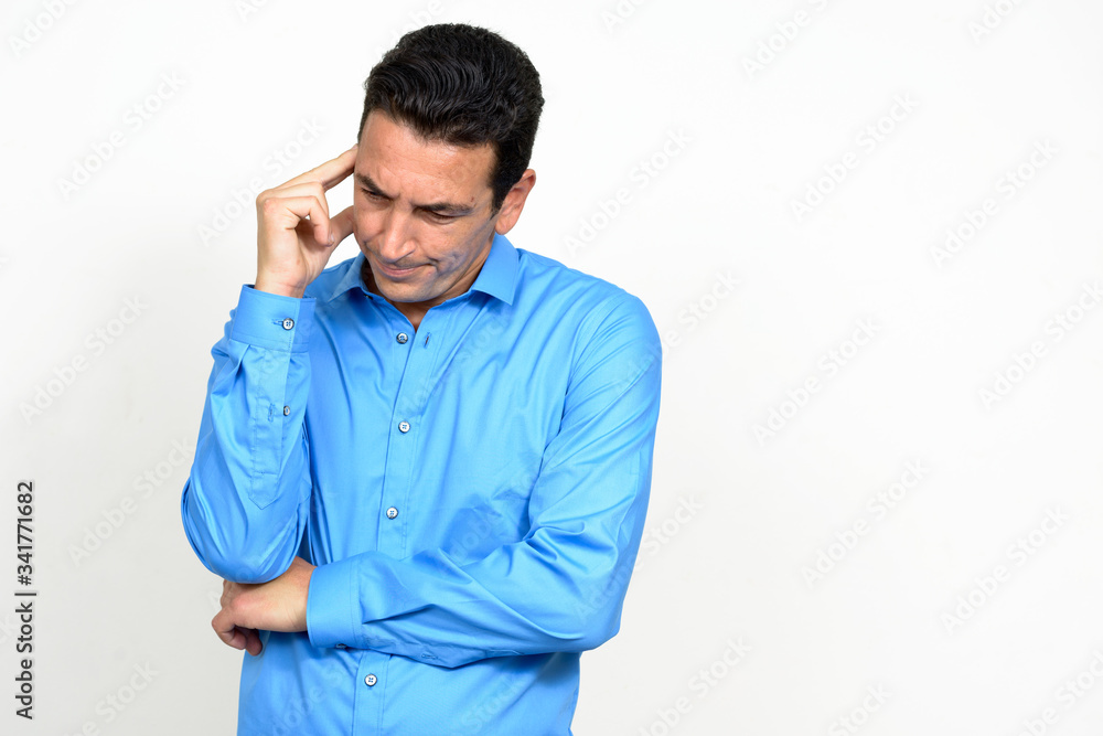 Portrait of stressed mature businessman having headache Portrait of stressed mature businessman having headache