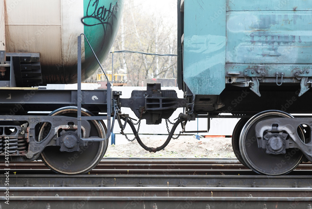 coupling of railway cars on the railway, close-up.Railway car coupling of railway cars on the railway, close-up.Railway car