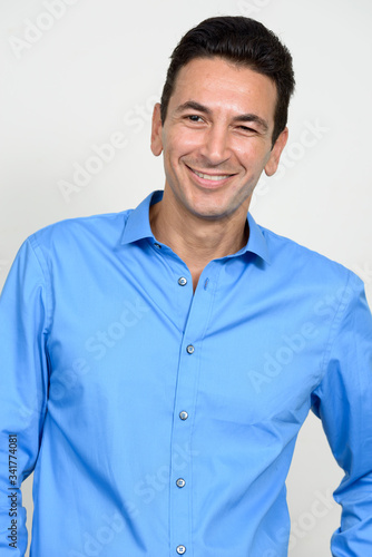 Portrait of happy mature handsome businessman smiling © Ranta Images