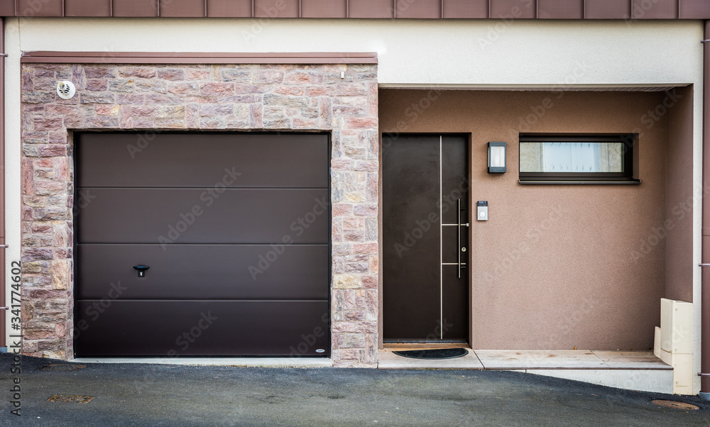 Fototapeta premium Entry of a modern house with garage in an estate