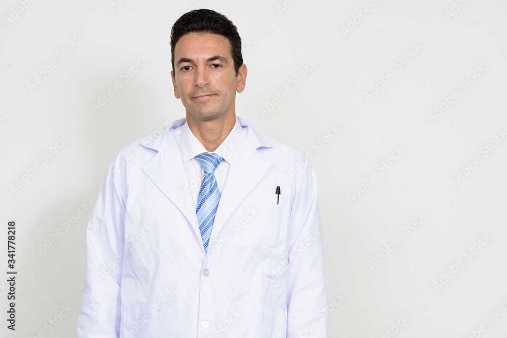 Portrait of mature handsome man doctor looking at camera Portrait of mature handsome man doctor looking at camera