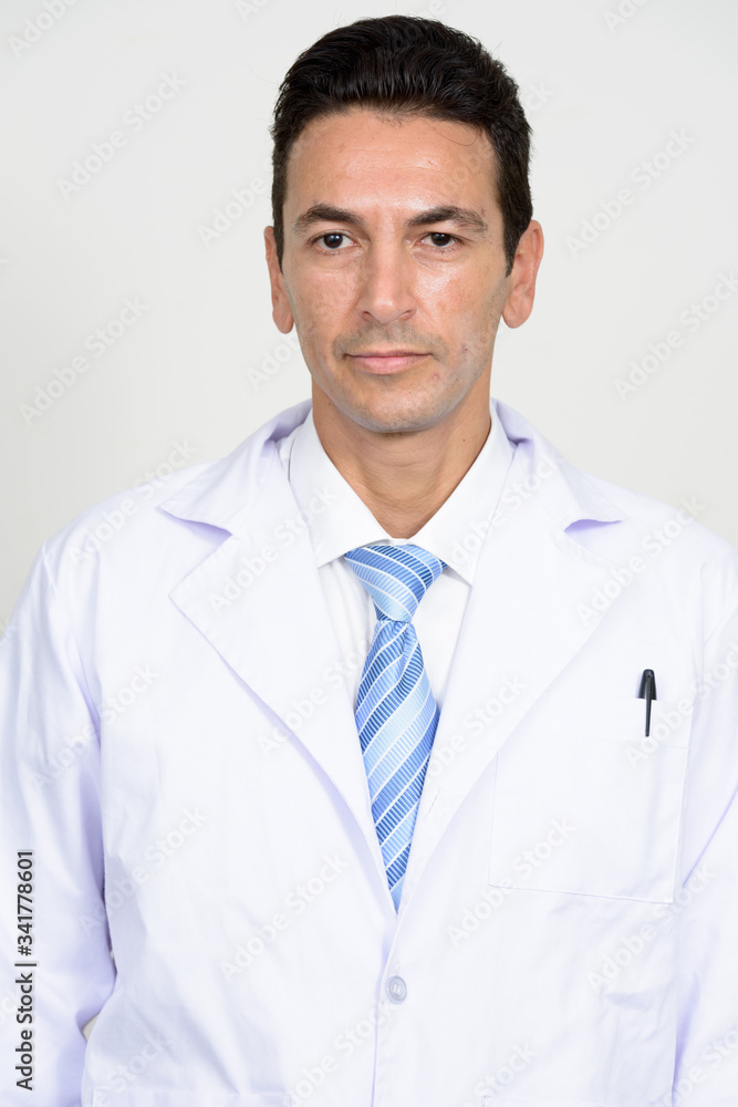 Portrait of mature handsome man doctor looking at camera Portrait of mature handsome man doctor looking at camera