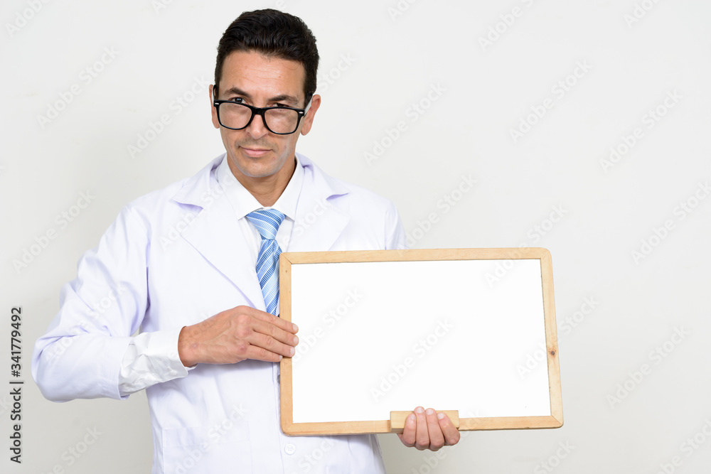 Mature man doctor with eyeglasses holding white board