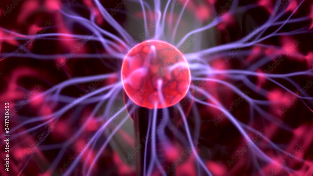 Plasma ball gives out small lightning. Experiments with electricity closeup. Plasma ball gives out small lightning. Experiments with electricity closeup.