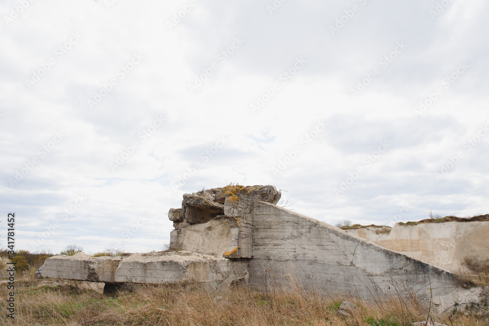 the ruins of german bunker in the beach of Normandy, France