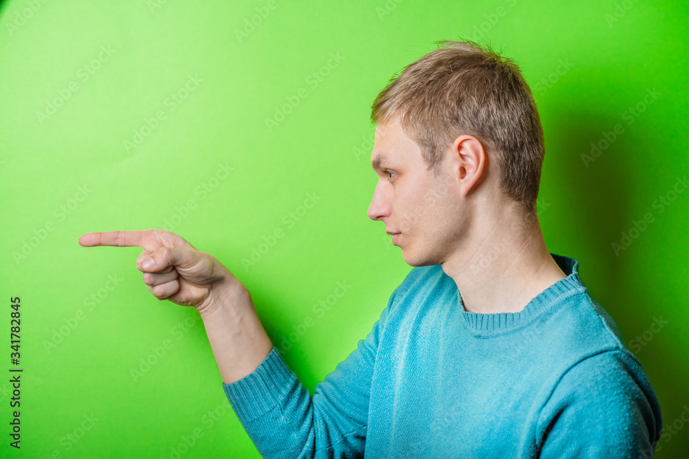 young man pointing at someone gesture with finger young man pointing at someone gesture with finger