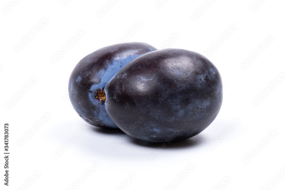 Fresh blue plums, isolated on white background, in close-up. Fresh blue plums, isolated on white background, in close-up.
