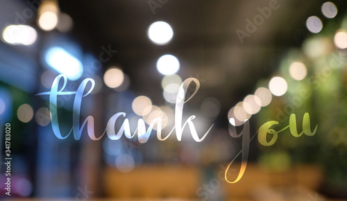 Thank you Hand drawn lettering on blurred lights background. Calligraphic Lettering, Modern Calligraphy for thank You. illustration, Earth Day