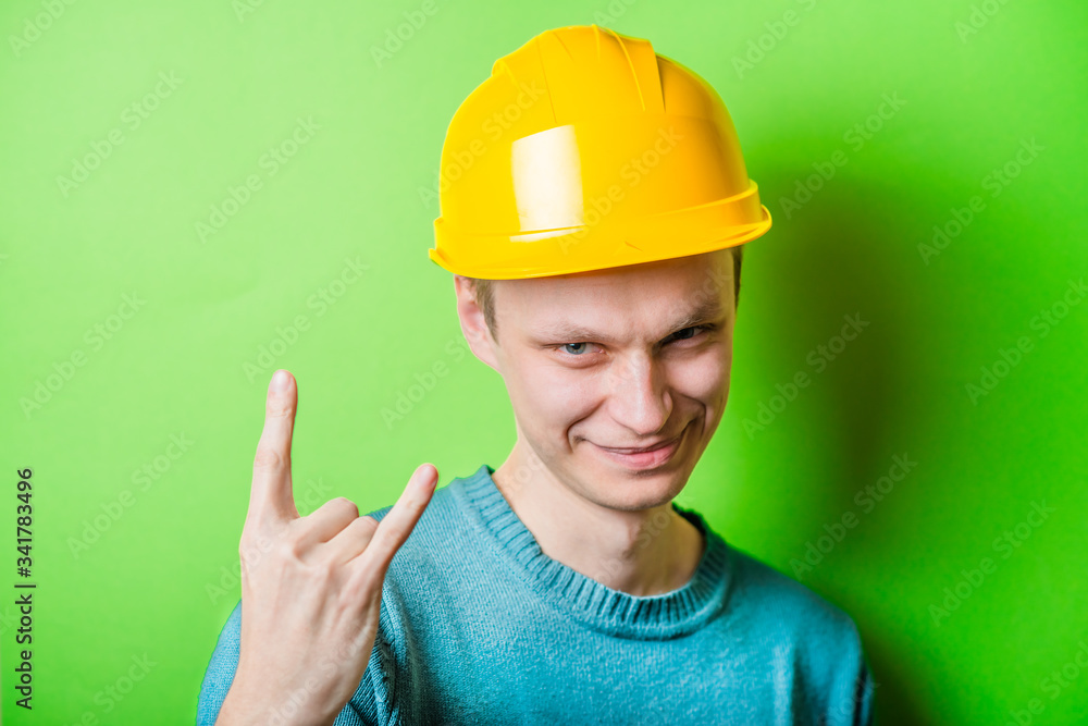 construction worker showing heavy metal rock-n-roll sign
