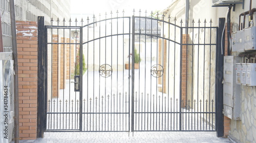 wrought iron gates in front of the house