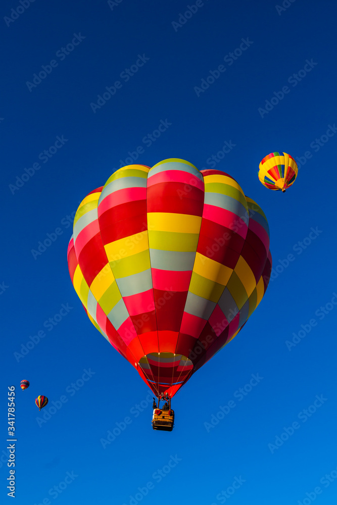 Naklejka premium Balloons Aloft For Early Morning Mass Ascension at The Albuquerque International Balloon Fiesta, Albuquerque, New Mexico, USA