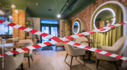 Hazard safety stripes across empty closed restaurant