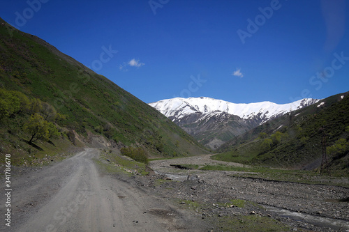 White peaks of Tian Shan mountains view near Fergana range, Kyrgyzia