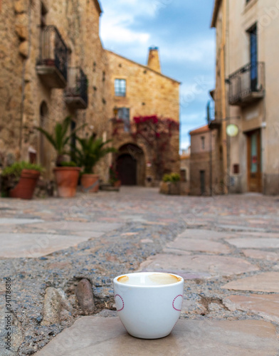 In a Mediterranean town a cup of coffee on the street