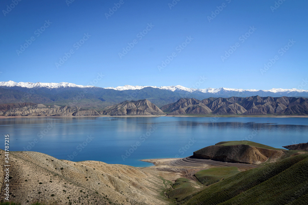 Toktogul Reservoir and Tian Shan mountains view by spring, Kyrgyzia