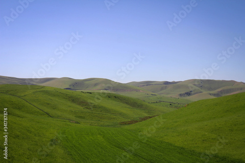 Calm green hills landscape near Jalal-Abad by spring, Kyrgyzia