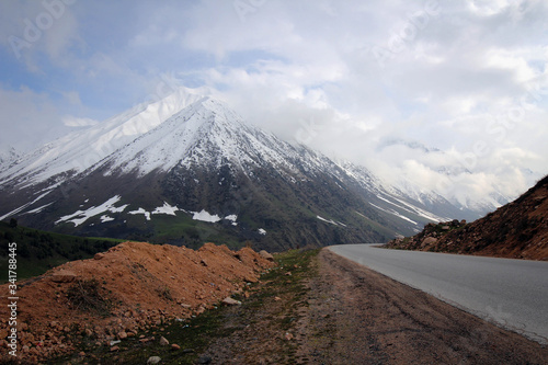 Too Ashuu mountain pass scenic view by spring with white peaks, Kyrgyzia photo