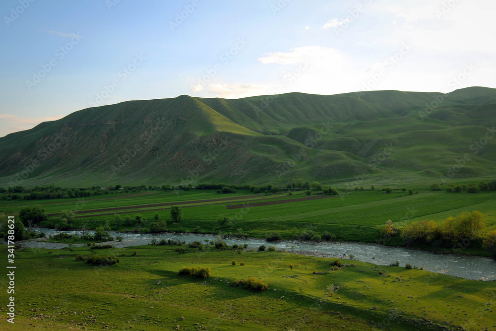 Scenic bright view of Torkent River by spring, Central Kyrgyzia