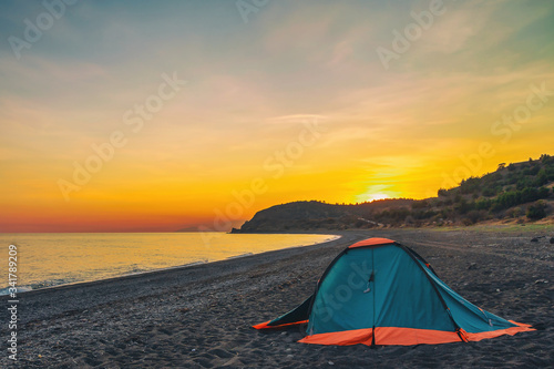 tourist evening landscape on the sea with a beautiful evening sky at sunset © serhio777