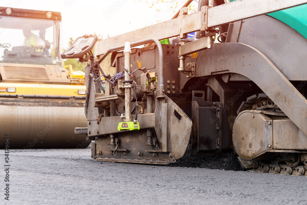 Green asphalt paver for road construction Green asphalt paver for road construction