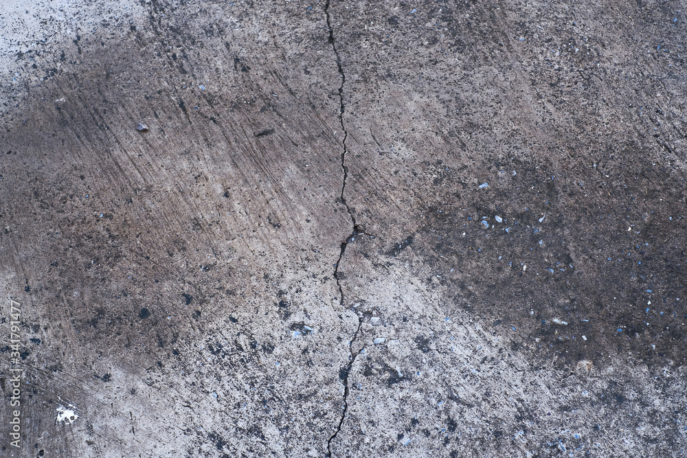 Fototapeta premium Crack concrete footpath. Close up crack cement road