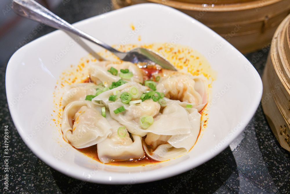 Dry wontons served with scallions on top
